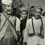 pashtun-tribesman-on-their-way-to-fight-in-kashmir-1947-v0-vj5qp44dy5zb1.jpg